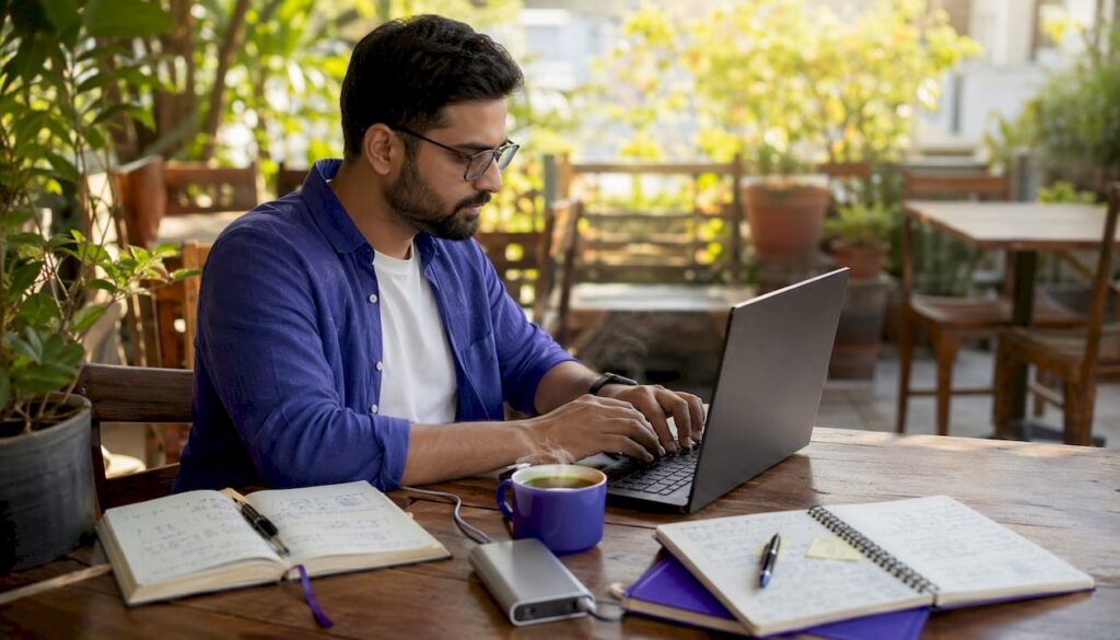 Person using hosting lookup tools on laptop